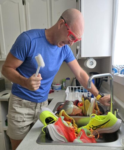 Noel washing sneakers in the sink
